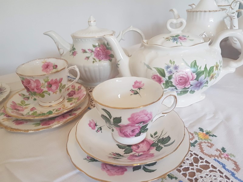 Vintage teapots and teacups with roses for hire